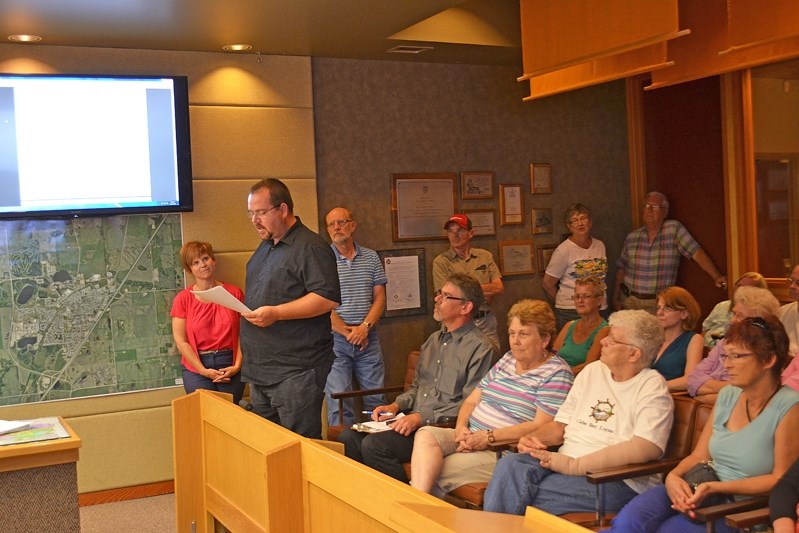 Dan Giesbrecht, a Westwood Mobile Park resident, addresses Innisfail town council on July 14 over the neighbourhood&#8217;s concerns to move a dump beside the community.