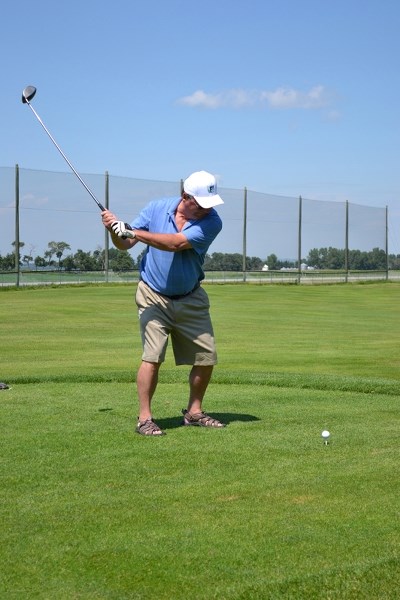 Len Denham of Innisfail gets ready for a swing during the 28th Annual Golf Classic sponsored by the Rotary Club of Innisfail.