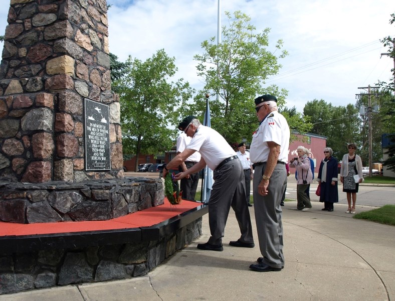 Korean war vets commemorate the fallen at the Innisfail Cenotaph.