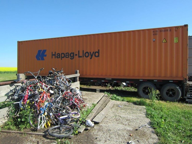Stack of bikes awaiting loading into container for recycling in Africa. Cal Cycle of Linden has been gathering bikes for 10 years.
