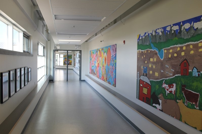 The pedway connects Ecole John Wilson Elementary School to Ecole Innisfail Middle School through a second-floor access.