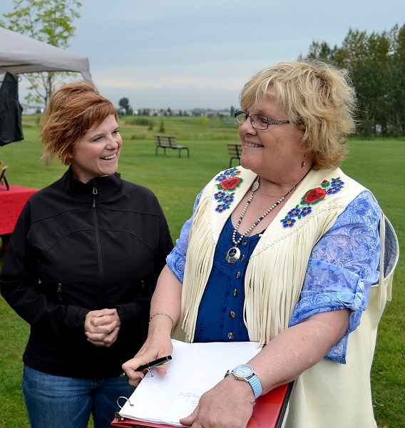 Diane Mineault, pictured here with Innisfail-Sylvan Lake MLA Kerry Towle (left) at last month&#8217;s first annual Metis Family Picnic, is leaving Innisfail due to health