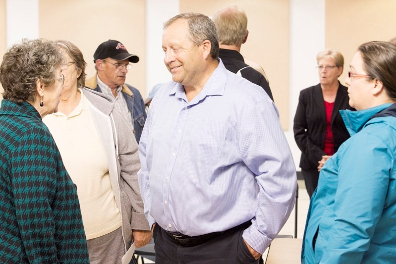 Innisfail Mayor Brian Spiller talks to residents following the waste transfer station open house.