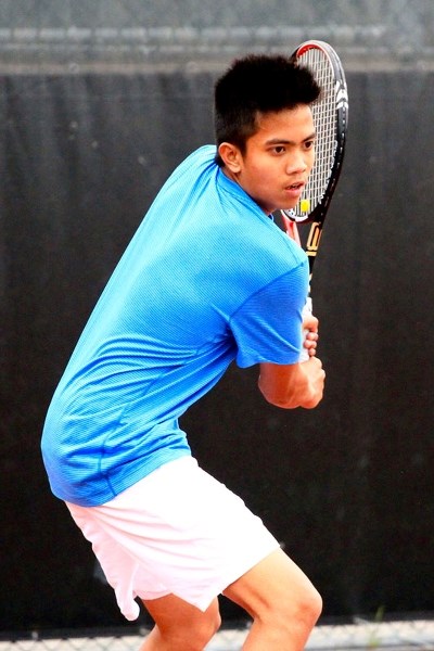 Charvher Vincent Dael focuses on a return volley during a recent practice.