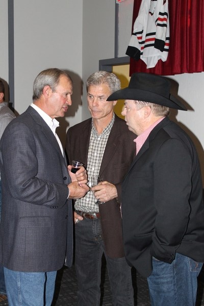 Brian Sutter (left), Rich Sutter (middle), and Danny Daines talk in between speeches at the Innisfail Eagles Sportsman Night held on Oct. 10 at the Innisfail Royal Canadian