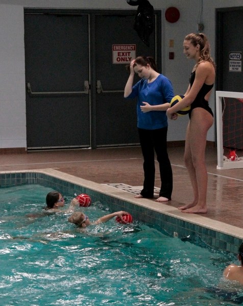 Canadian National Youth Team member Kyra Christmas (right) of High River shared her water polo expertise with the Innisfail Hurricanes on Oct. 27.