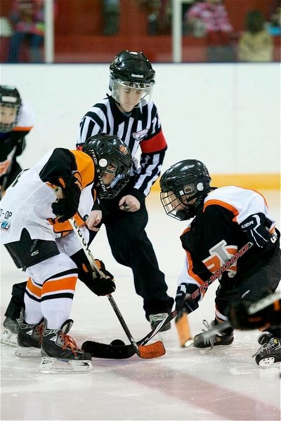 Dynamite players face off during the recent Innisfail Minor Hockey Association tournament.