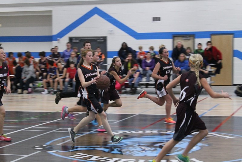 Penhold Skyhawks march down the court during their inaugural game over the Innisfail Mustangs.