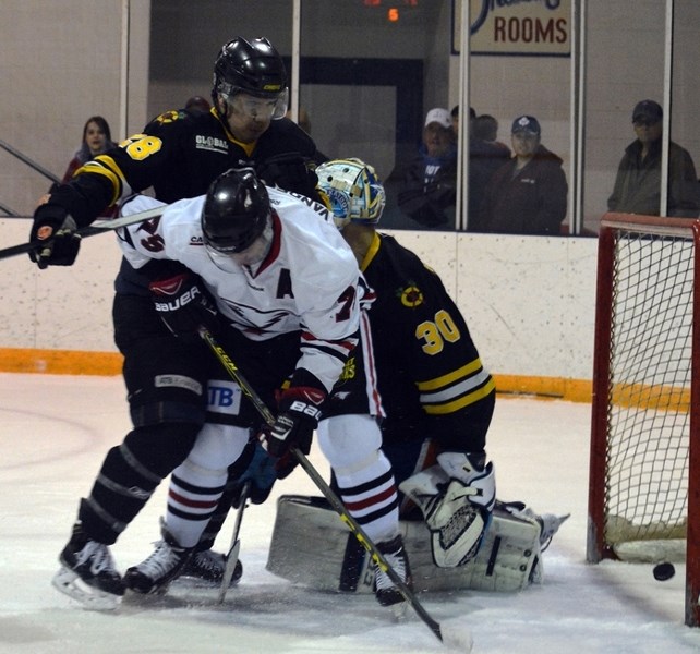 Innisfail Eagles forward Pete Vandermeer battles in front of the net as the puck crosses the goal-line during the last home game of the regular season against the Fort