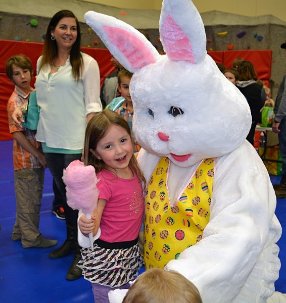 Arianna Constantine gives the Easter Bunny a big hug during the annual Easter celebration in Penhold at the Penhold Regional Multiplex on March 19.