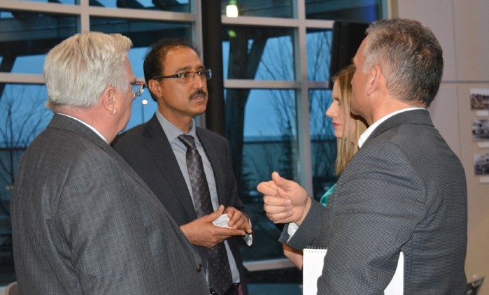 Amarjeet Sohi, minister of infrastructure and communities, left, with Penhold mayor Dennis Cooper at the Mayors&#8217; Forum in Red Deer on March 29.