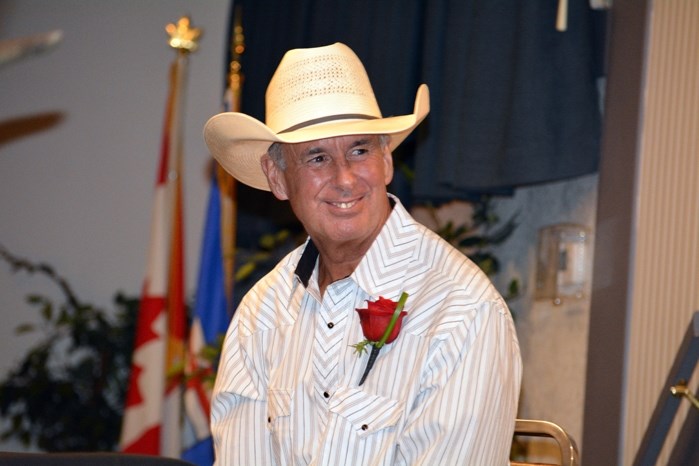 Hockey Night In Canada host Ron MacLean smiles as he listens to guests during the Hot Stove segment at the annual Sportsmen&#8217;s Dinner in Innisfail July 14.