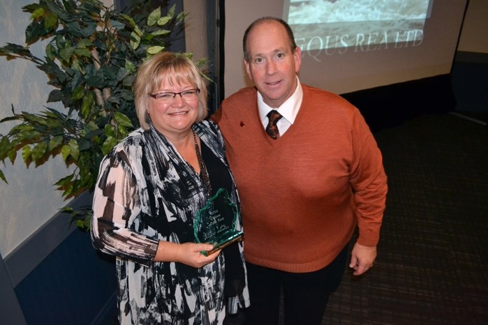 Lucille Paquette-Lohmann, longtime case worker for Big Brothers Big Sisters of Prairies to Peaks, with her Citizen of the Year Award, as Mark Kemball, who MCed the Oct. 14