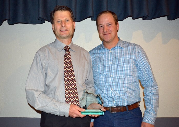 Associates Dr. Rob DeHaan, left, and Dr. Andrew Ritson- Bennett accept the award for Business Of the Year at the 2016 Community and Business Awards Gala Oct. 14. Missing from 