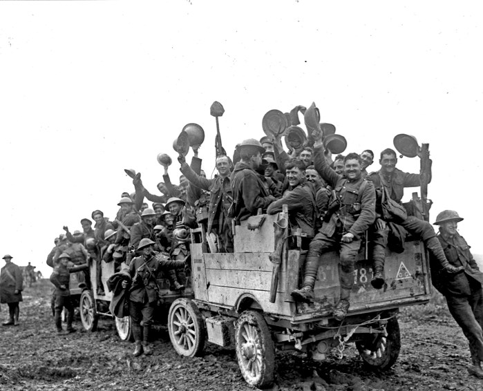 Motor trucks carry Canadian troops from the trenches at the Battle of the Somme.