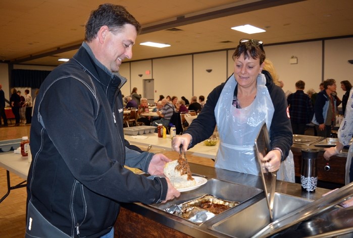 Jason Schneider was one of many Innisfail and area residents out to enjoy a roast beef sandwich during the annual beef on a bun fundraiser for the Innisfail Hospital