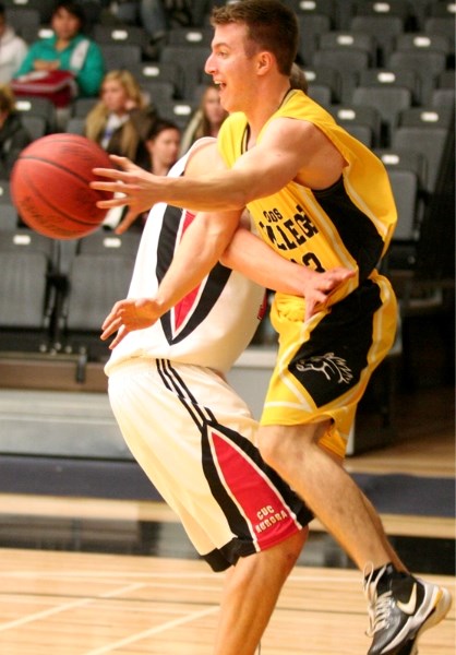 Olds College guard Will Belliveau looks to dish the ball off during Thursday&#8217;s home game against CUC.