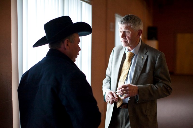 Mel Knight speaks to an area resident during an event hosted at Olds College as part of the ministers&#8217; tour across Alberta.