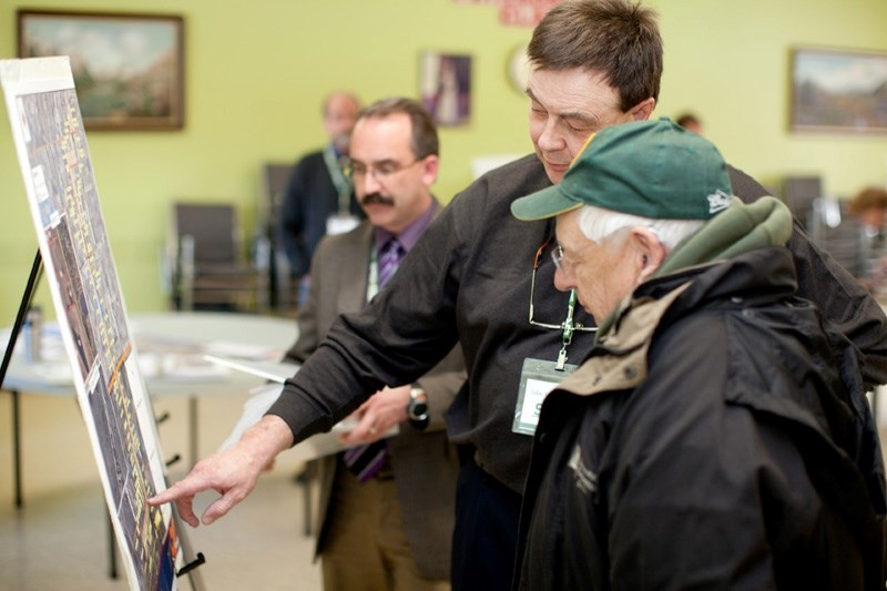 John VanDoesburg goes over the regional wastewater line plans with an area resident during the open house Thursday in Bowden.