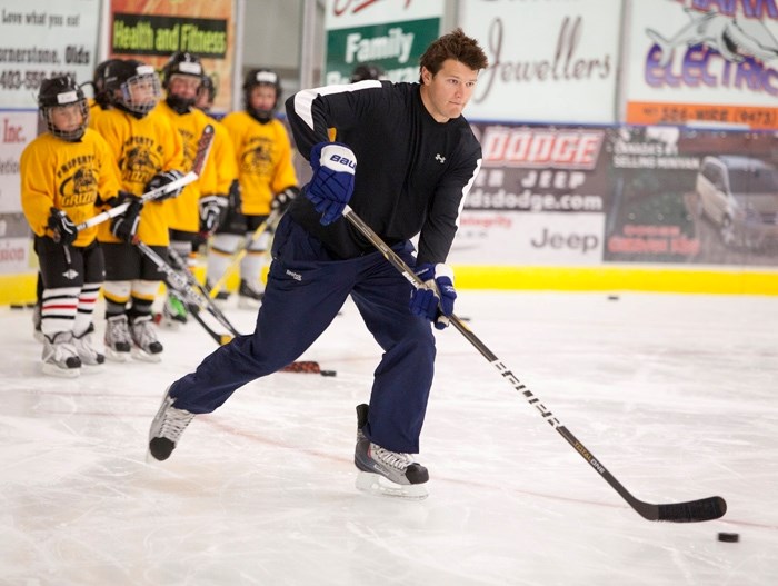 Toronto Maple Leaf forward Jay Rosehill leads a group of minor hockey players through drills on Thursday during the Grizzlys Hockey School that took place all last week.