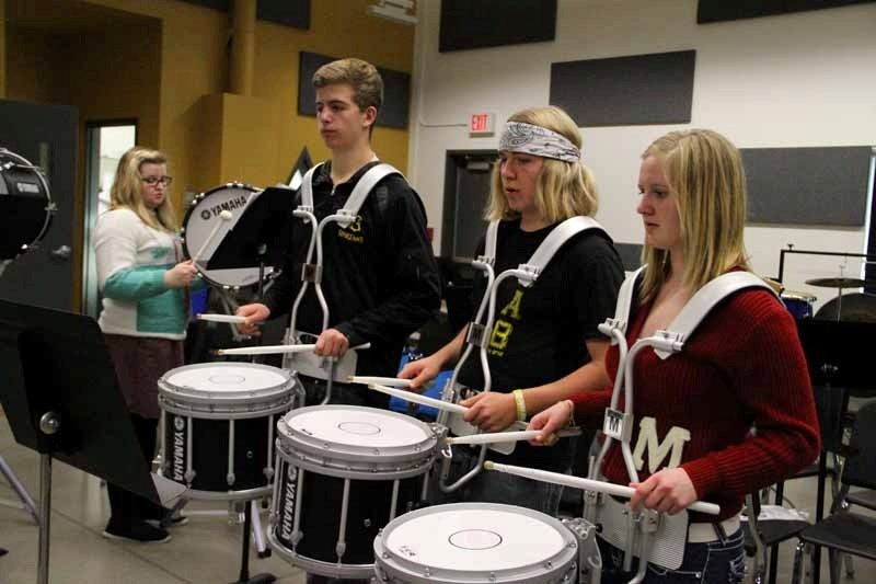 Mary Nielsen, Kevin Spicer, Quade Smith and Courtney Schafer practise drumline once a week at the Fine Arts and Multimedia Centre.