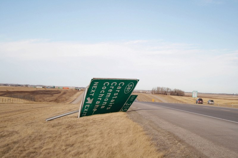 An exit sign on Highway 2 was blown over due to the extreme winds on Sunday afternoon.