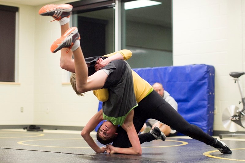 Olds High School students Austin Mitchell, left, and Meagan Wild practise sparring during a wrestling practice at Olds High School on Jan. 9. CLICK ON PICTURE TO ENLARGE