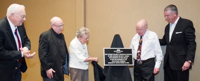 Bob Clark (left) vice chair of the Olds College board of governors, Barry Mehr (second from left), chair of the board and college president Tom Thompson (far right)