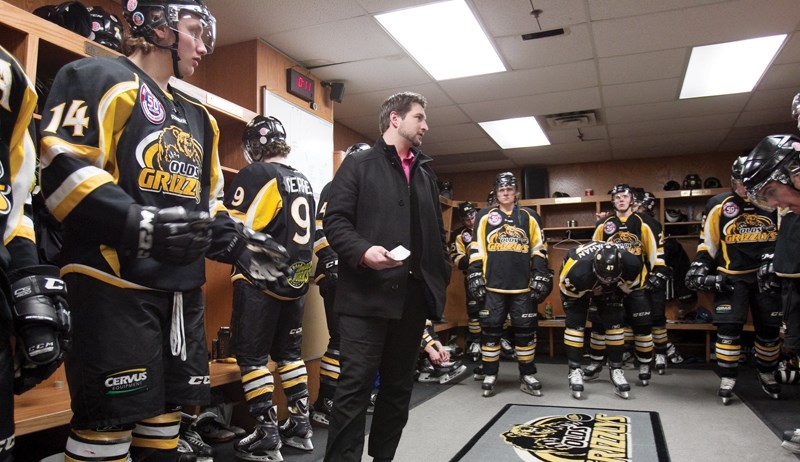 Olds Grizzlys coach Brett Hopfe speaks to the team just before their game against the Camrose Kodiaks at the Olds Sports Complex on Feb. 4. The Grizzlys won the game 3-2 in