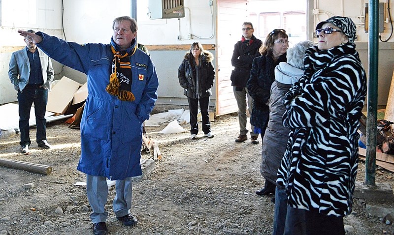 Kerry Moynihan of Olds College shows off an old building on the school&#8217;s campus as Mayor Judy Dahl looks on during the Alberta Heritage Resources Foundation&#8217;s