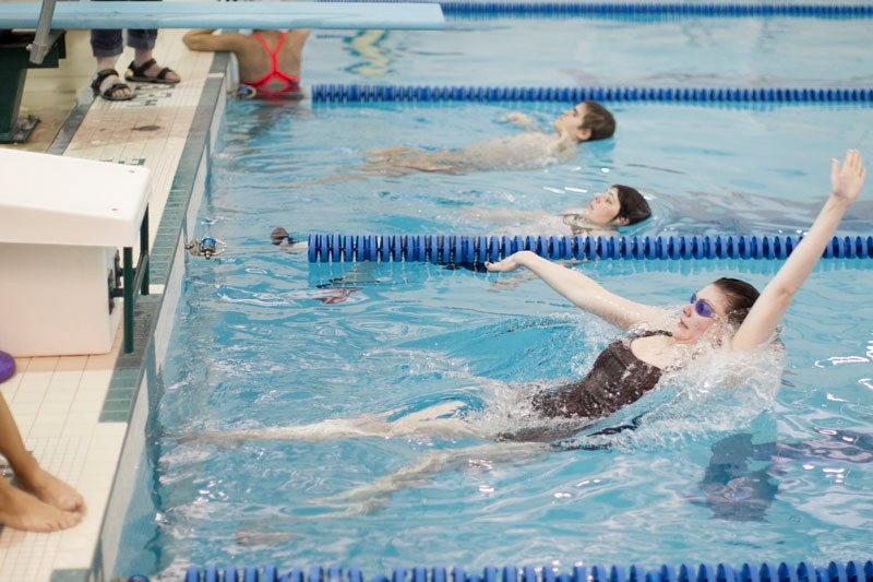 Misty Olsen, pictured here in the near lane during an Olds Special Olympics swim team practice on Feb. 19, tallied three first-place finishes at a Didsbury swim meet on Feb.