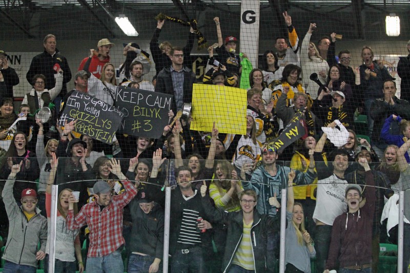 Roughly 50 fans of the Olds Grizzlys who travelled by bus to see the team take on the Okotoks Oilers in Game 5 of their best-of-five first-round playoff series cheer after