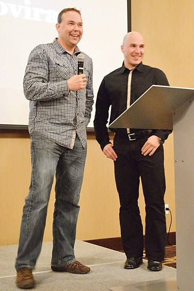 (From left) Tyler Graham and Miro Skovira, members of the 1993-94 Centennial Cup-winning Olds Grizzlys team, share a laugh on stage at the Pomeroy Inn and Suites on April 5.