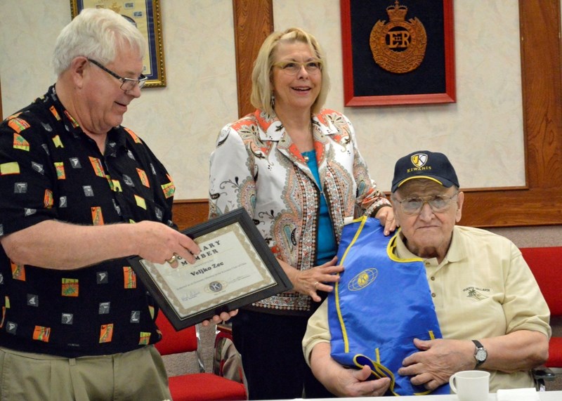 From left, Kiwanis Club of Olds vice-president Hugh Bodmer and Olds mayor Judy Dahl present Alex Zec with honourary membership at a club meeting on May 15 at the Olds Legion. 