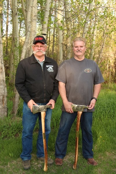 Gordon Leeson (left) and Brian Hoschka retired from the Olds Fire Department this spring. Leeson served for 30 years and Hoschka served for 37 years. Here they are pictured
