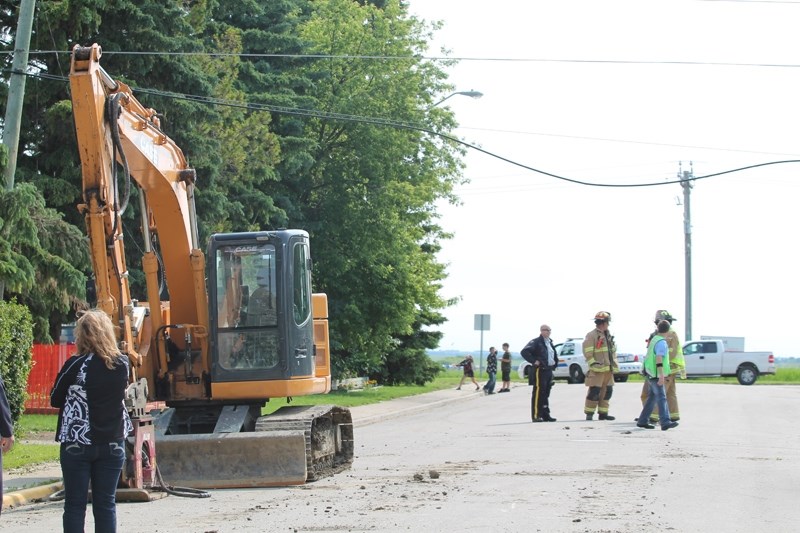 This excavator struck an overhead cable line on 44 Street on the morning of June 30. The impact damaged two nearby utility poles and sparked a small tree fire while causing a 