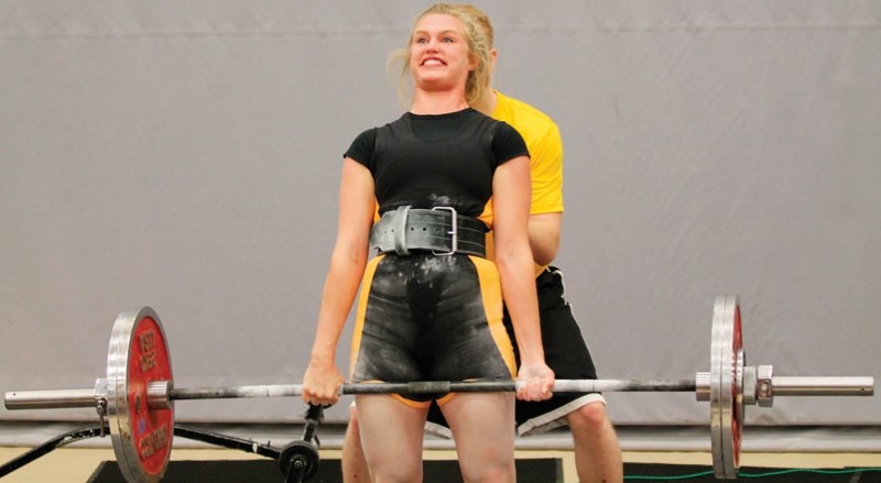 Ariel Chessall of Olds nails her second lift in the deadlift competition on July 6.