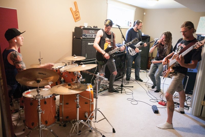 Tattered is made up of (from left) Clayton Braun on drums, his brother Ben Braun on rhythm guitar and backup vocals, Tim Daigle on lead guitar, singer Brad Rempel and bassist 