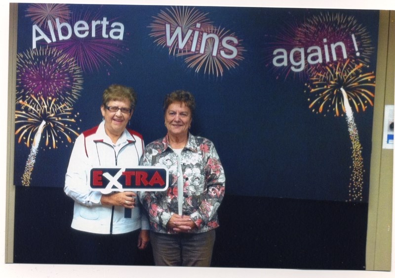 Elsie LaFlamme (left) and Gerda Irving pose after winning $100,000 in the Lotto Max Extra draw.