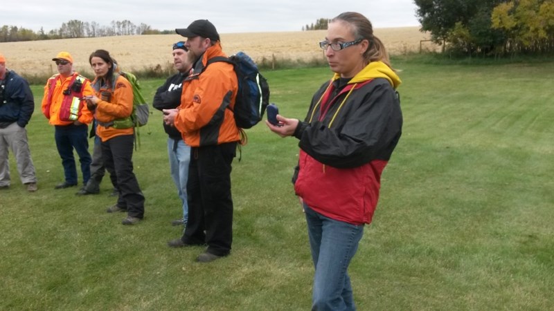 Search and Rescue Train the Trainer participants work with compasses. From foreground to background: Joyce Courtoreille &#8211; Olds Search and Rescue, James Perrin &#8211;