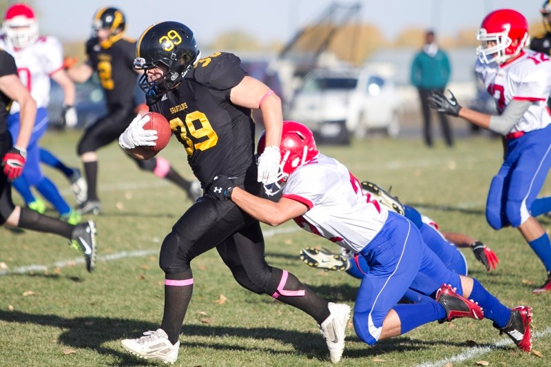 Pictured here is action from a game between the Olds High School Spartans and the Sir Winston Churchill Bulldogs.