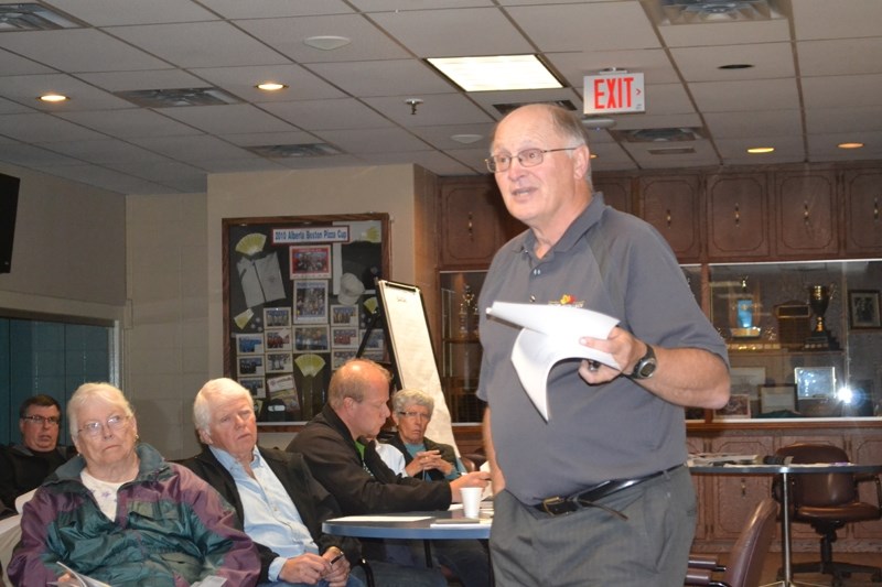 Olds Curling Club president Henry Czarnota addresses attendees during the club&#8217;s annual general meeting.