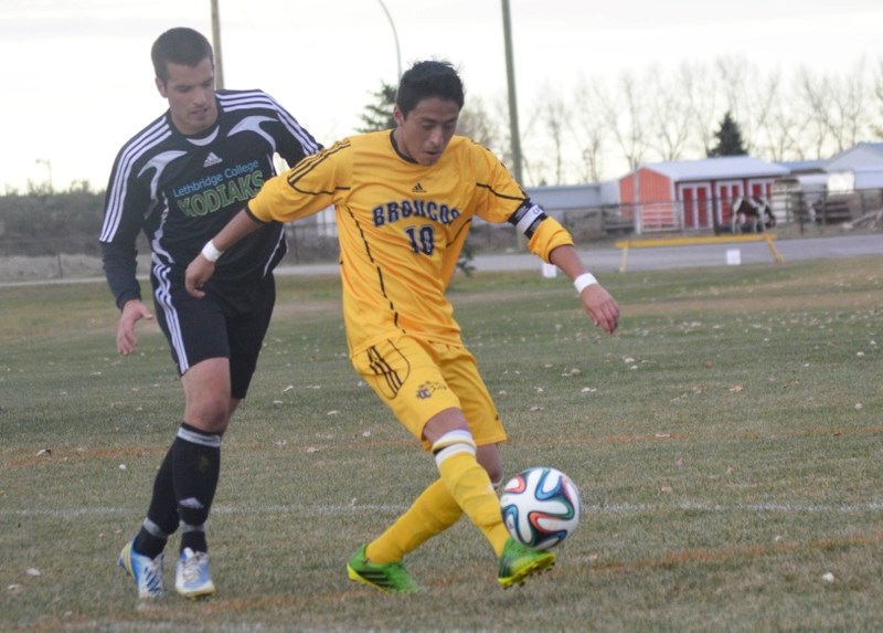 On right, Alex Gutierrez, a defender on the Broncos soccer team, takes possession of the ball against the Lethbridge College Kodiaks on Oct. 19 at Normie Kwong Park.