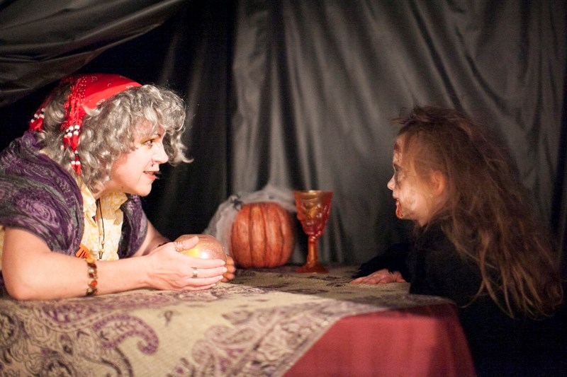 Griselda the fortune teller, otherwise know as Chantal Marchildon, tells Cheyenne Baird&#8217;s fortune at the Mountain View Museum.