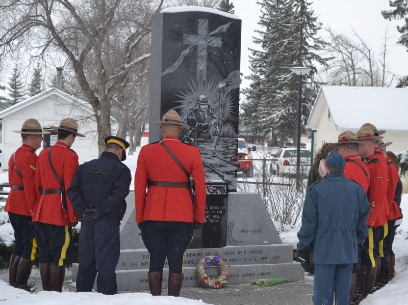 Officers pay tribute to fallen soldiers at the Cenotaph in Centennial Park after Olds Remembrance Day services.