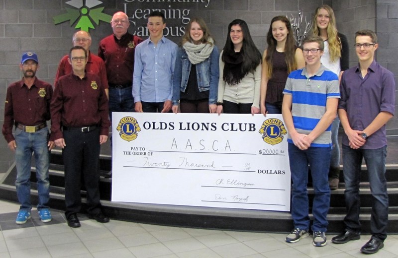 The Olds Lions Club presented a $20,000 cheque to Olds High School&#8217;s ASLC student steering committee on Nov. 18. The money will go toward hosting the 2015 Alberta