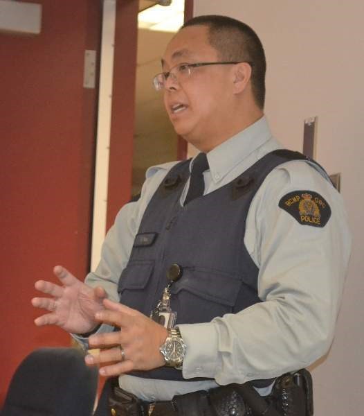 RCMP recruiter Cst. Wilson Yee addresses a handful of people in Olds who indicated an interest in joining the police service.