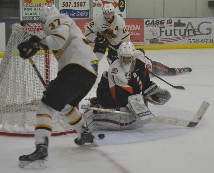 Grizzlys players swarm around the Drumheller net during Tuesday night&#8217;s game at the Sportsplex. The Grizzlys earned a 6-0 shutout.