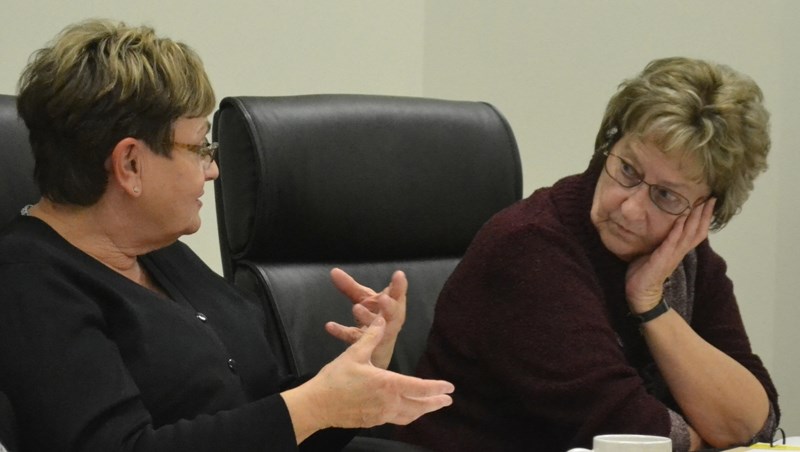 Councillor Sheila Church (right) listens as fellow councillor Sandra Gamble gives her position during a Bowden town council meeting.