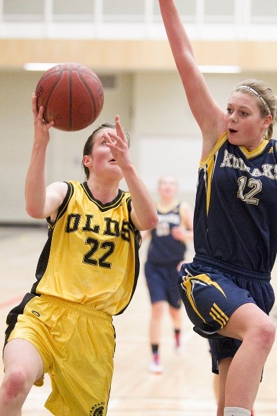 Olds High School Spartans junior varsity basketball player Laura Klinck goes for a layup during the Spartans&#8217; game against the Hugh Sutherland School Kodiaks at Olds